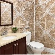 Vanity featuring a solid-surface countertop with an integrated oval basin and dark wood-finish cabinetry, complemented by decorative geometric wall tile and a framed wall mirror
