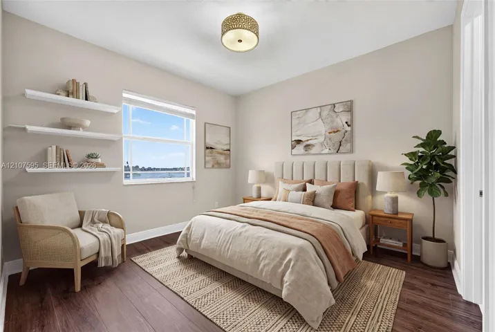 Room featuring wood-finish flooring, three built-in wall-mounted shelves, a single-hung window, and a drum-style ceiling light fixture