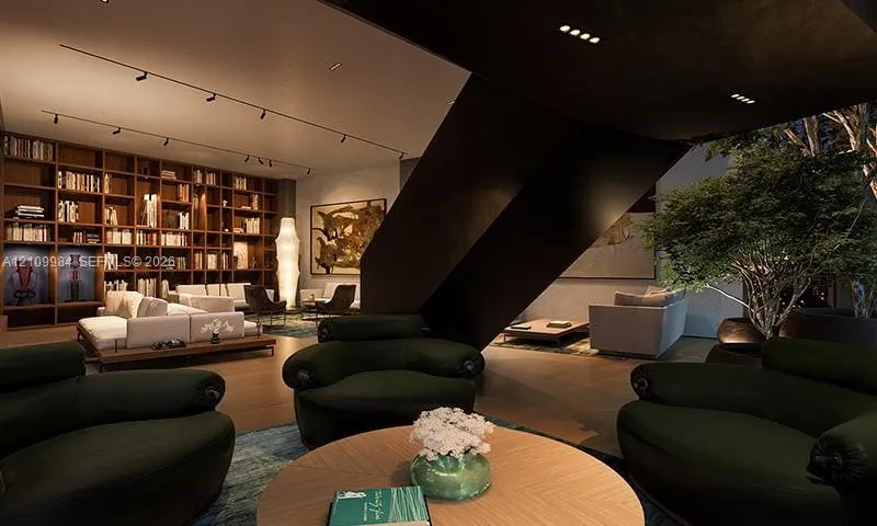Floor-to-ceiling built-in wooden shelving, dark sculptural staircase, recessed track lighting, and indoor planter feature