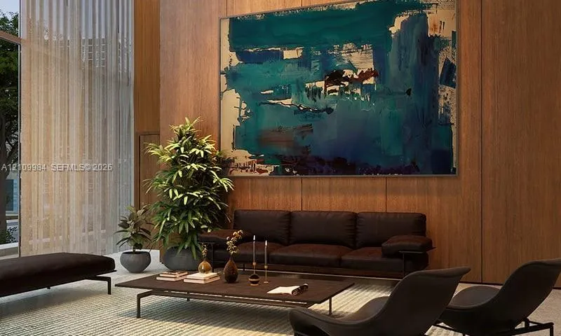 Double-height space featuring floor-to-ceiling windows and wood-paneled walls