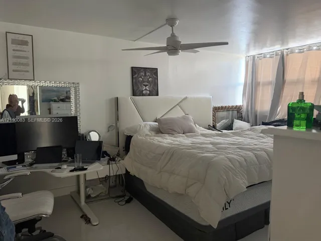 White ceiling fan with integrated lighting and multi-pane windows