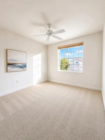 Neutral-toned carpeting, multi-pane window