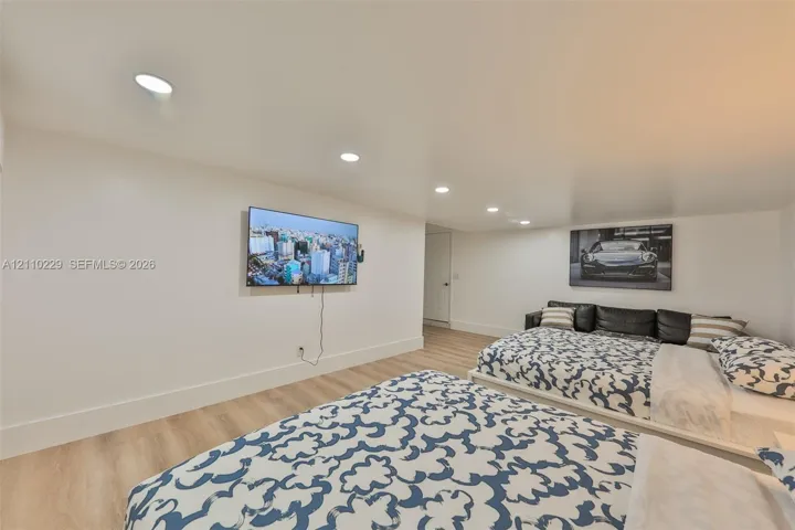 Interior space featuring wood-finish flooring and recessed lighting