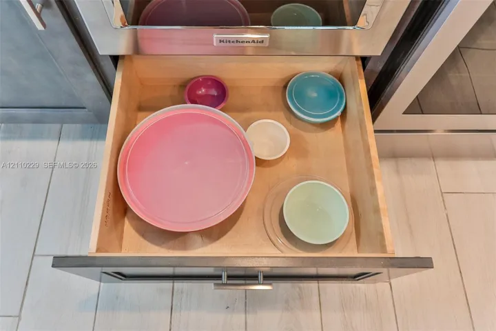 Deep-drawer cabinetry featuring natural wood construction, full-extension glides, and modern stainless steel hardware
