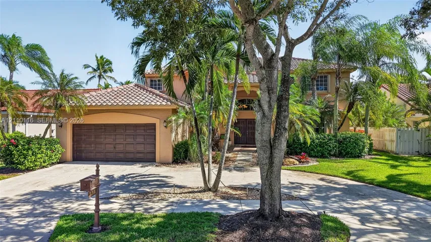 BRAND NEW tile roof, arched entryway, and 2-car garage circular driveway