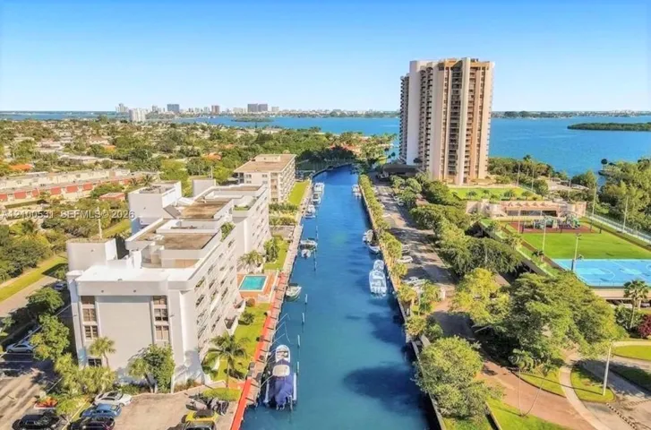 Waterfront property featuring a private boat dock with direct bay and ocean access