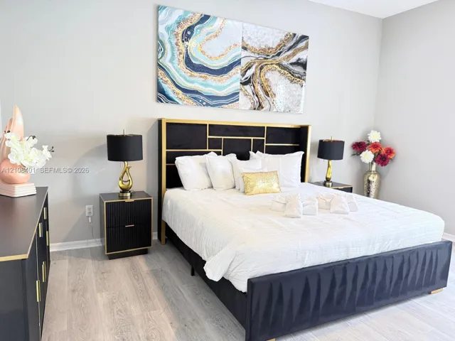 Light-toned wood-finish flooring set against neutral wall paint