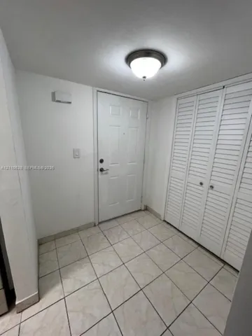 FOYER ENTRANCE WITH EXTRA STORAGE CLOSET