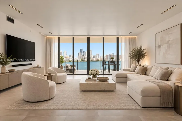 Floor-to-ceiling glass panel doors, integrated linear recessed lighting, large-format tile flooring, custom built-in cabinetry, and expansive private balcony