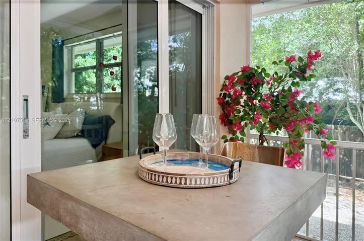 Screened-in porch with interior and exterior access.