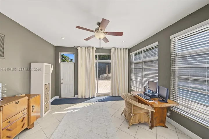 Sun Room with entrance to the pool area