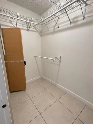 Walk-in closet featuring large-format