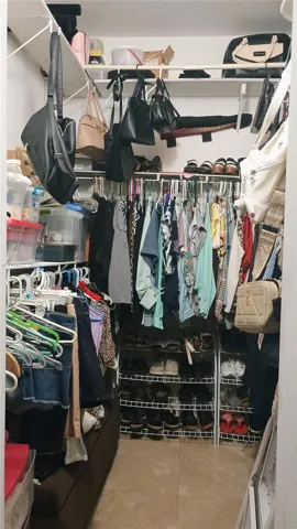 Walk-in closet featuring floor-to-ceiling white wire shelving, multi-level hanging rods, and integrated wire shoe racking