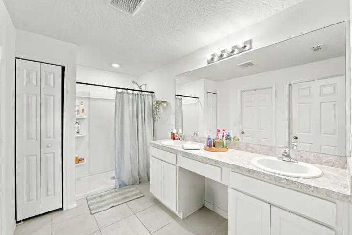 Primary bath with extended vanity and shower.
