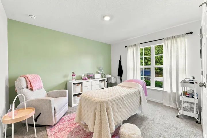 Bright bedroom with plenty of space for furniture.