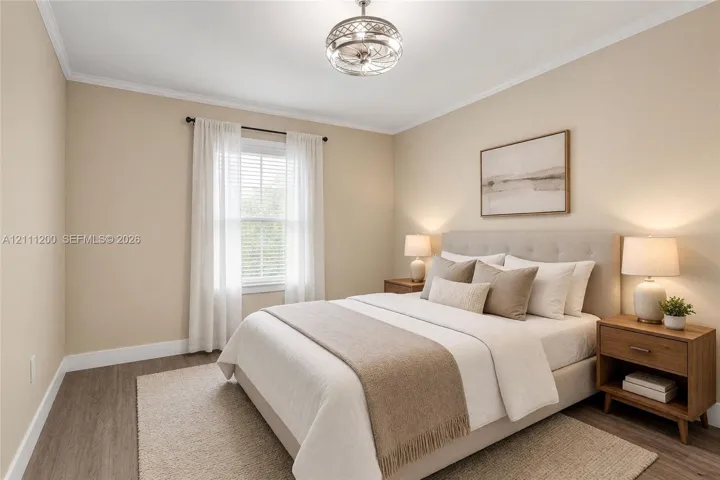 AI Generated Neutral-toned room featuring wood-finish flooring, a double-hung window, and a decorative industrial-style flush mount ceiling light fixture