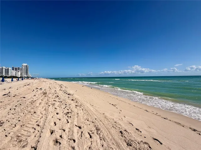 Sandy shoreline featuring direct ocean access
