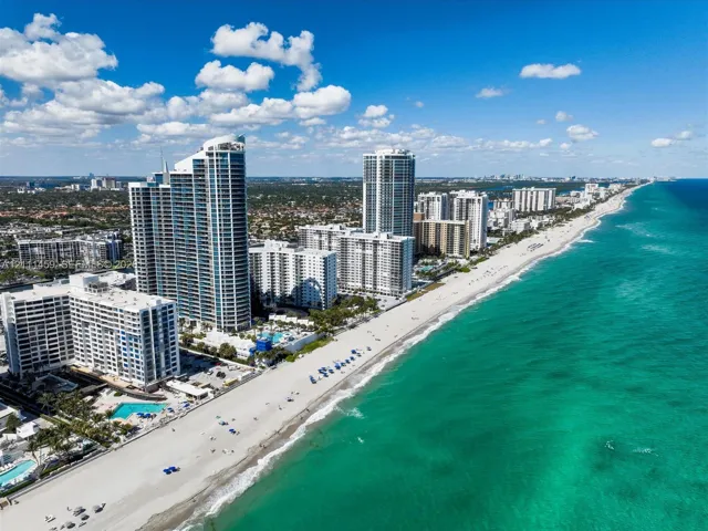 High-rise coastal towers featuring direct beach access, expansive shoreline frontage, and proximity to the Atlantic Ocean