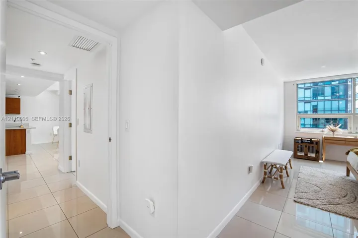 Interior space featuring large-format tile flooring, recessed lighting, and expansive windows