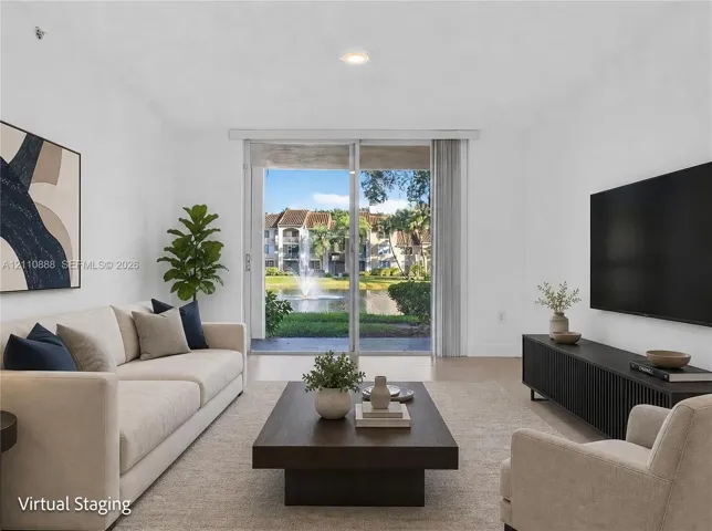 Living room featuring sliding glass doors and neutral tile flooring