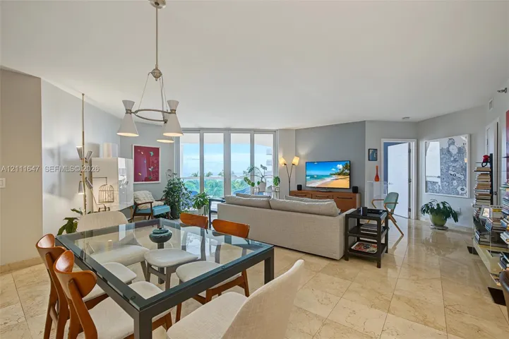 Open-concept living area featuring floor-to-ceiling windows
