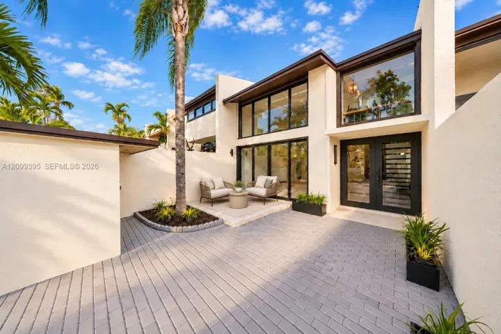 Welcome Entrance private courtyard with a tropical, modern feel.