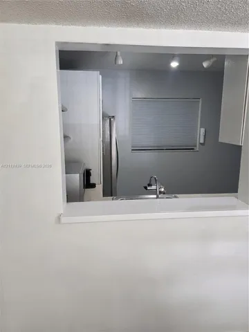 LARGER PASS THRU WINDOW TO DINING AREA
