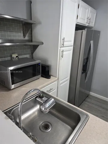 SS SHELVING, REF., RANGE, SINK, MICROWAVE