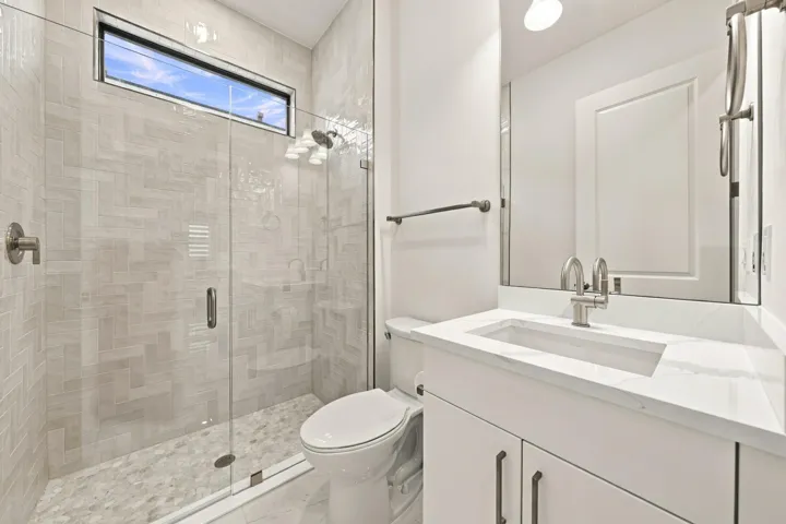 3rd bathroom, upgraded quartz countertop, upgraded glass frameless shower with tile and mirror to the ceiling
