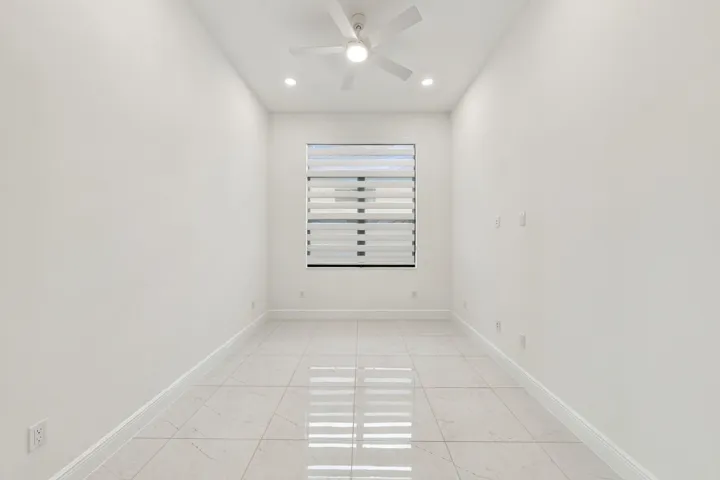 Flex room with raised tv outlet, ceiling fan and zebra blinds/Office/4th bedroom