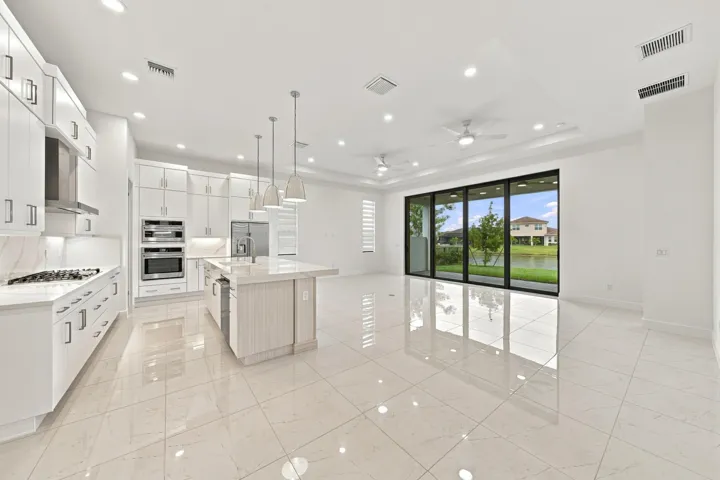 Great room, kitchen island and dining room
