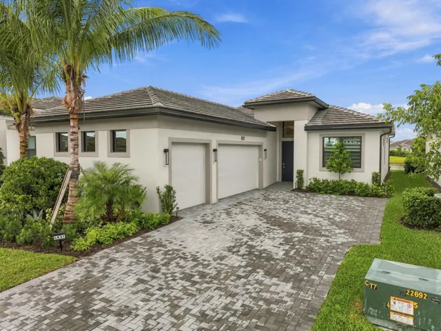 Lila model with 3 car garage and paved driveway