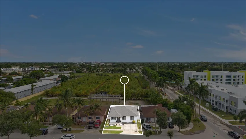 Single-story residence featuring a hip roof, concrete driveway, and front lawn