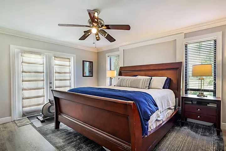 Primary suite with doors to the pool deck