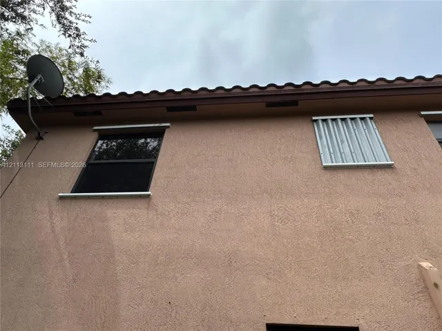 Hurricane Shutters installed corrugated metal hurricane shutters