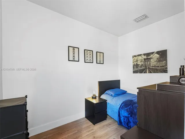 Neutral-toned walls paired with wood-finish flooring
