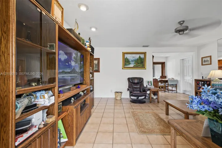 Tile flooring, recessed lighting, and a ceiling fan
