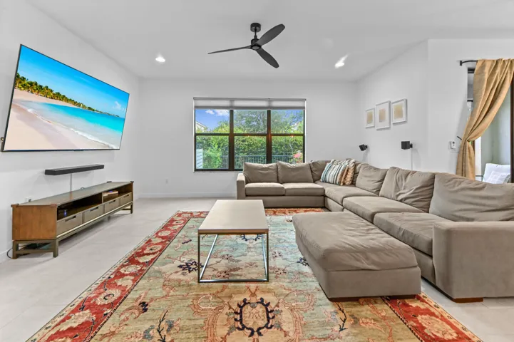 Spacious Living Room with high ceilings, recessed lighting and ceiling fan