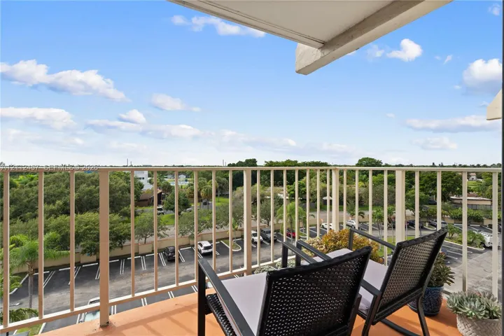 Private balcony featuring metal railings and concrete flooring