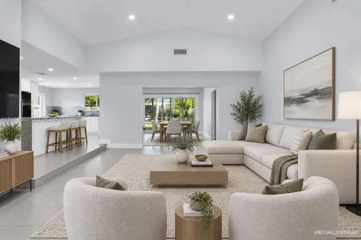 Vaulted ceilings, recessed lighting, and large-format flooring