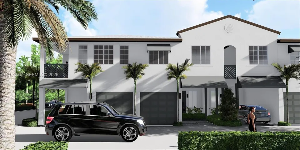 Two-story stucco exterior featuring covered balconies, multi-panel garage doors, and metal window awnings