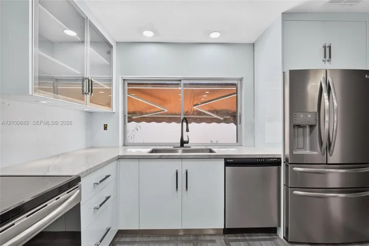 Kitchen featuring with views to the back yard through the large window over the sink*