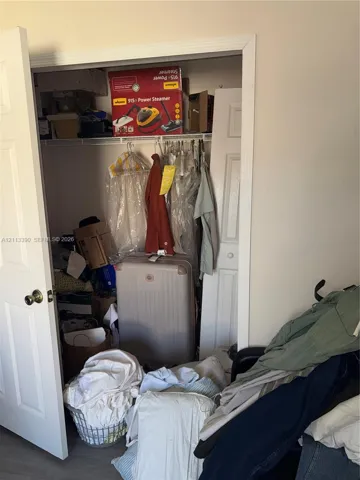 Standard closet featuring double-panel swing doors and wire shelving