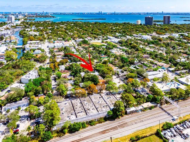 Aerial perspective highlighting coastal proximity and mature residential landscaping