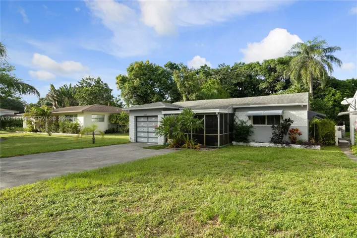 Single-story residence featuring a gray exterior, integrated garage with a multi-pane door, and a screened-in porch