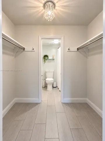 Walk through closet from master bedroom to bathroom