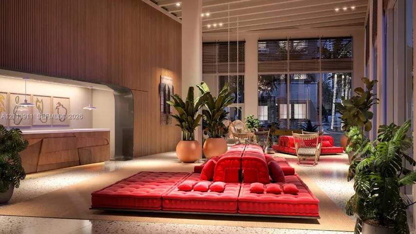 Lobby featuring double-height ceilings, floor-to-ceiling windows, wood-slat wall paneling, terrazzo flooring, and a built-in wood-veneer service counter
