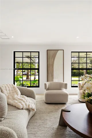 Black-framed multi-pane windows and recessed ceiling lighting