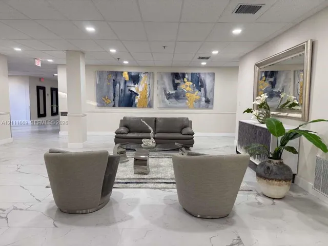 Common area featuring stone-finish flooring and recessed lighting