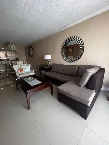 Large-format tile flooring and neutral wall finishes